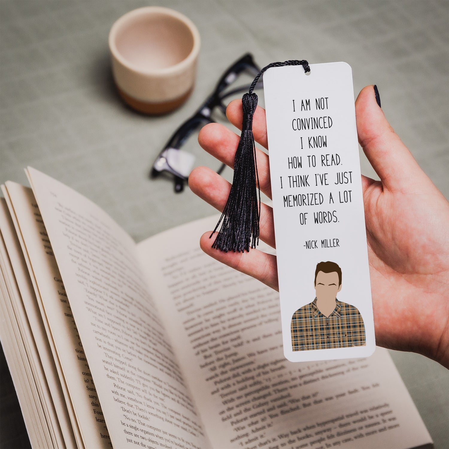 ALuminium bookmark with Nick Millet design on it